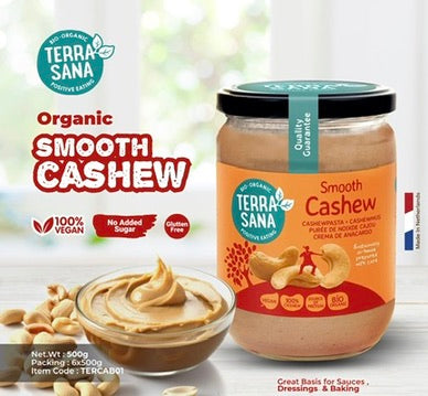 Terra Sana Organic Smooth Cashew spread jar with a bowl of spread and cashews on a light background