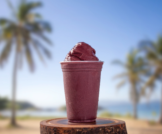 A vibrant, deep purple acai smoothie , featuring Dragon Superfoods Acai Powder from Phytamins.